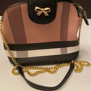 Purse with gold bow buckle